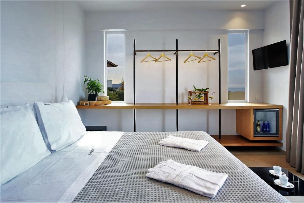 Postel nebo postele na pokoji v ubytování Basilico Suites Adults Only by Estia