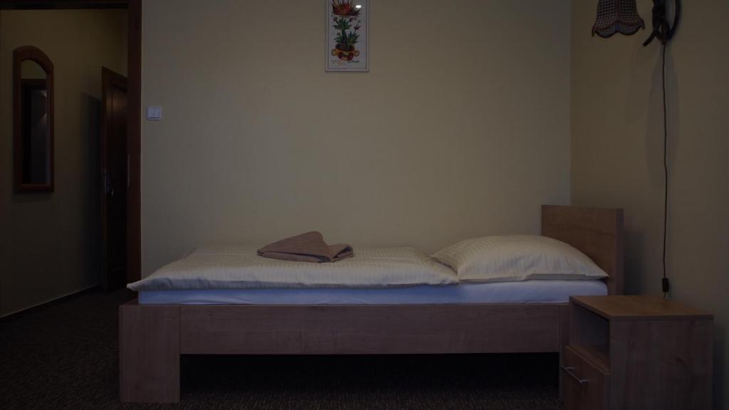 A bed or beds in a room at Hotel Slnecny Dvor