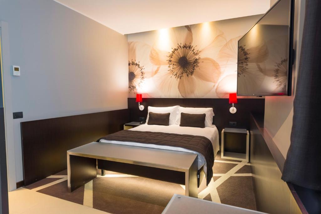 Ліжко або ліжка в номері Hotel Manin