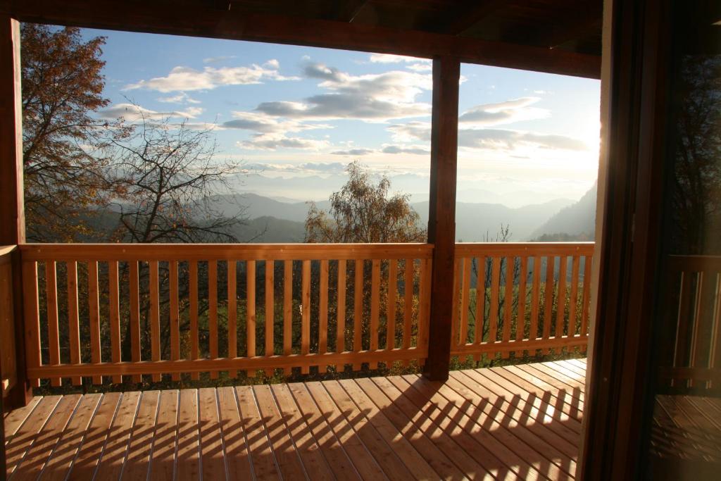 a screened in porch with a view of the mountains at Alte Volksschule - schual in gradne in Liebenfels