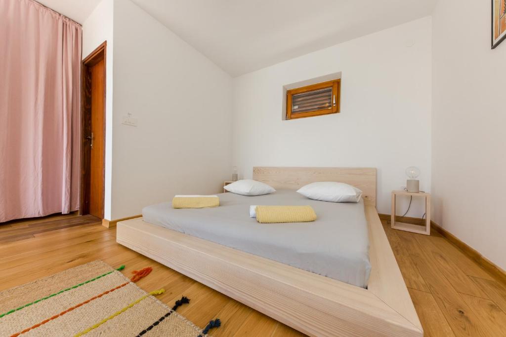Postel nebo postele na pokoji v ubytování Casa Dubi Hvar