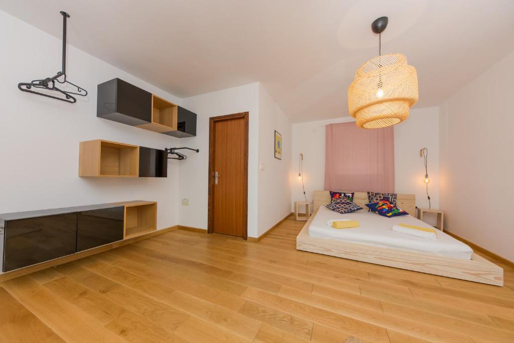 Postel nebo postele na pokoji v ubytování Casa Dubi Hvar
