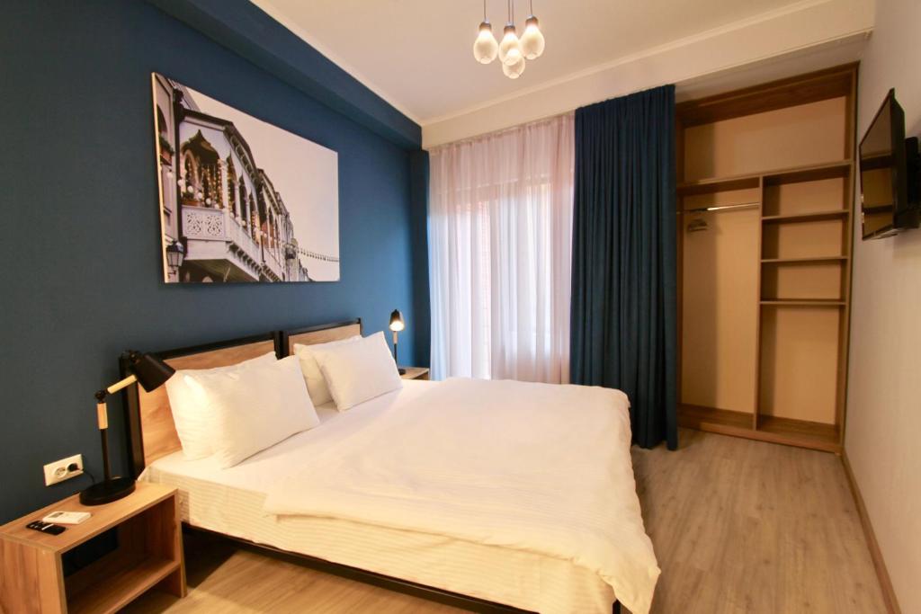 Postel nebo postele na pokoji v ubytování Apart-hotel TARHUN