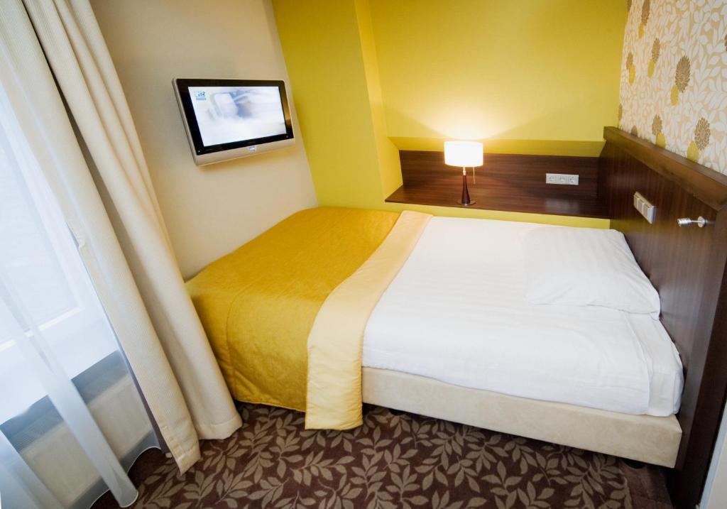 Postel nebo postele na pokoji v ubytování Hotel Van Walsum