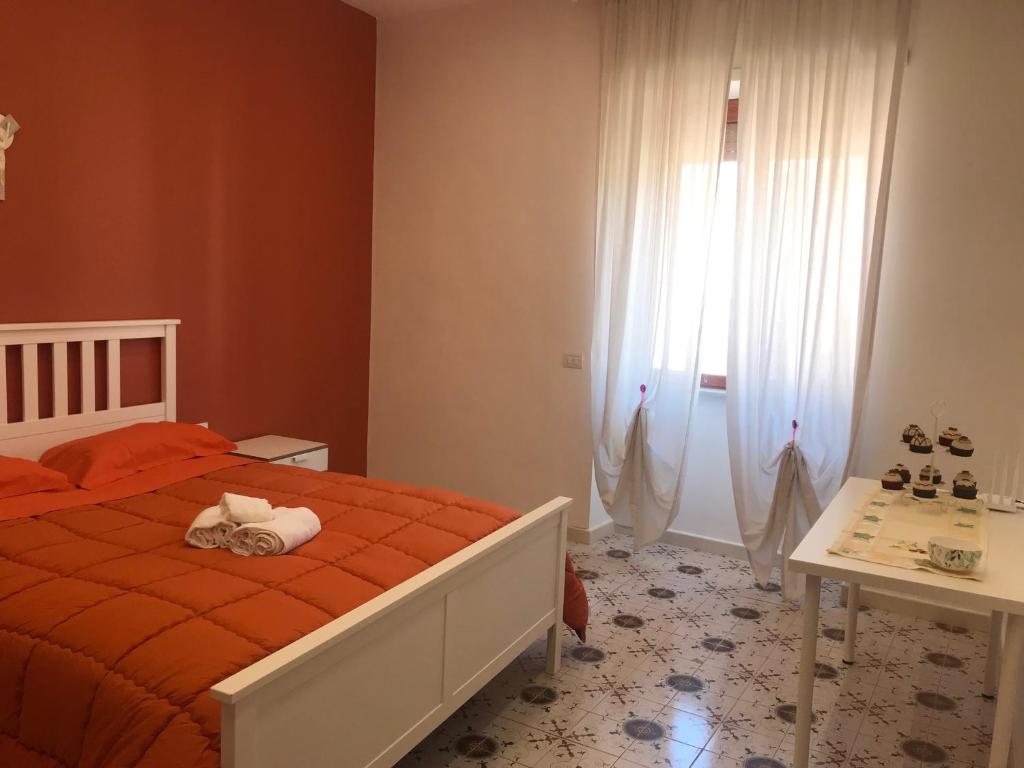 Postel nebo postele na pokoji v ubytování Maria Maddalena Holiday House