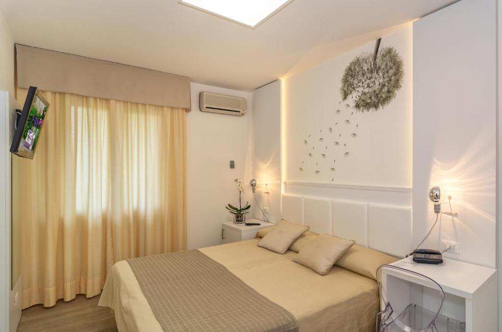 Postel nebo postele na pokoji v ubytování Hotel Hermitage