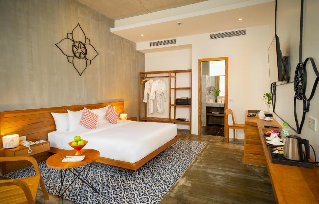 Postel nebo postele na pokoji v ubytování Phka Chan Hotel