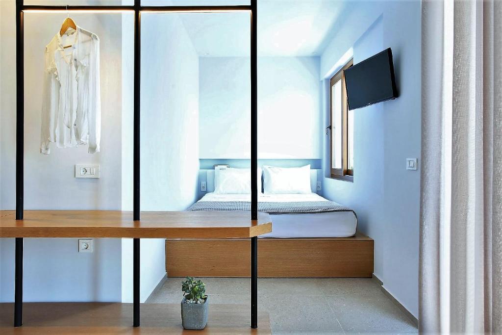 Postel nebo postele na pokoji v ubytování Basilico Suites Adults Only by Estia