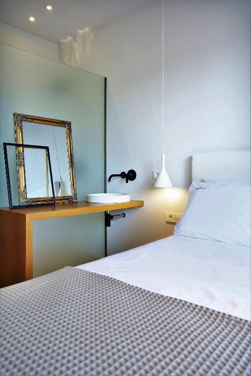 Postel nebo postele na pokoji v ubytování Basilico Suites Adults Only by Estia