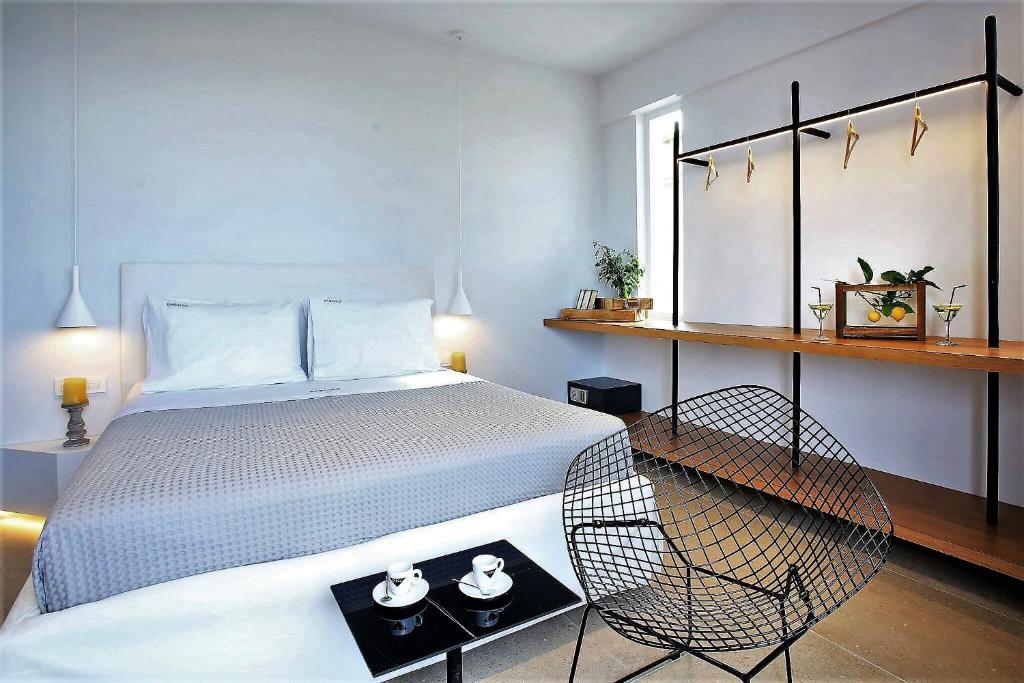 Postel nebo postele na pokoji v ubytování Basilico Suites Adults Only by Estia