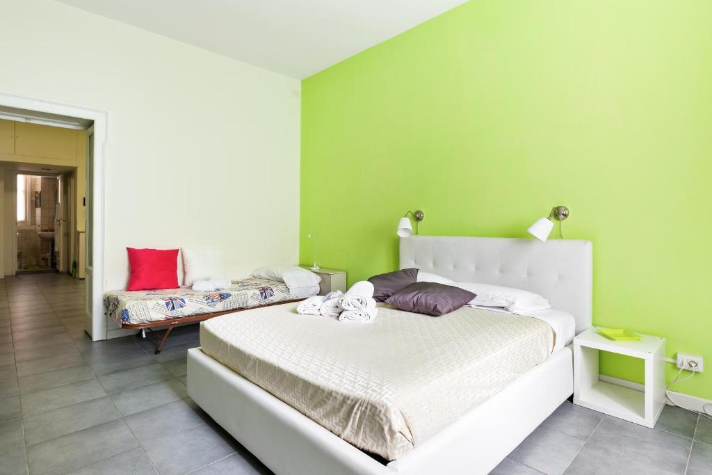 Łóżko lub łóżka w pokoju w obiekcie Cenisio & Sempione Cosy Flat