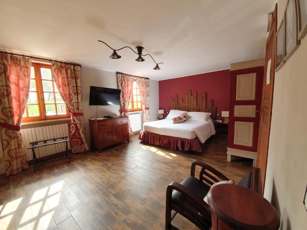 Postel nebo postele na pokoji v ubytování Locanda Il Rustichello