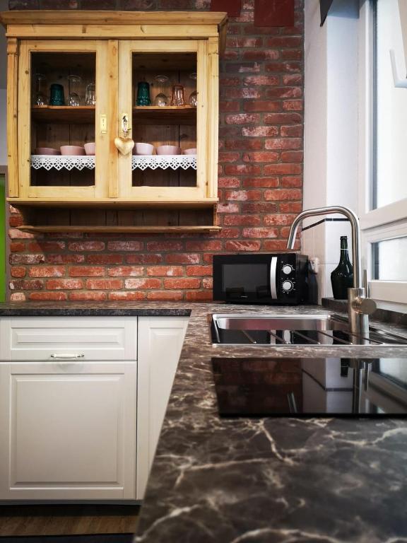 Kuchyň nebo kuchyňský kout v ubytování Millenium Inn Ferienwohnung Top 2