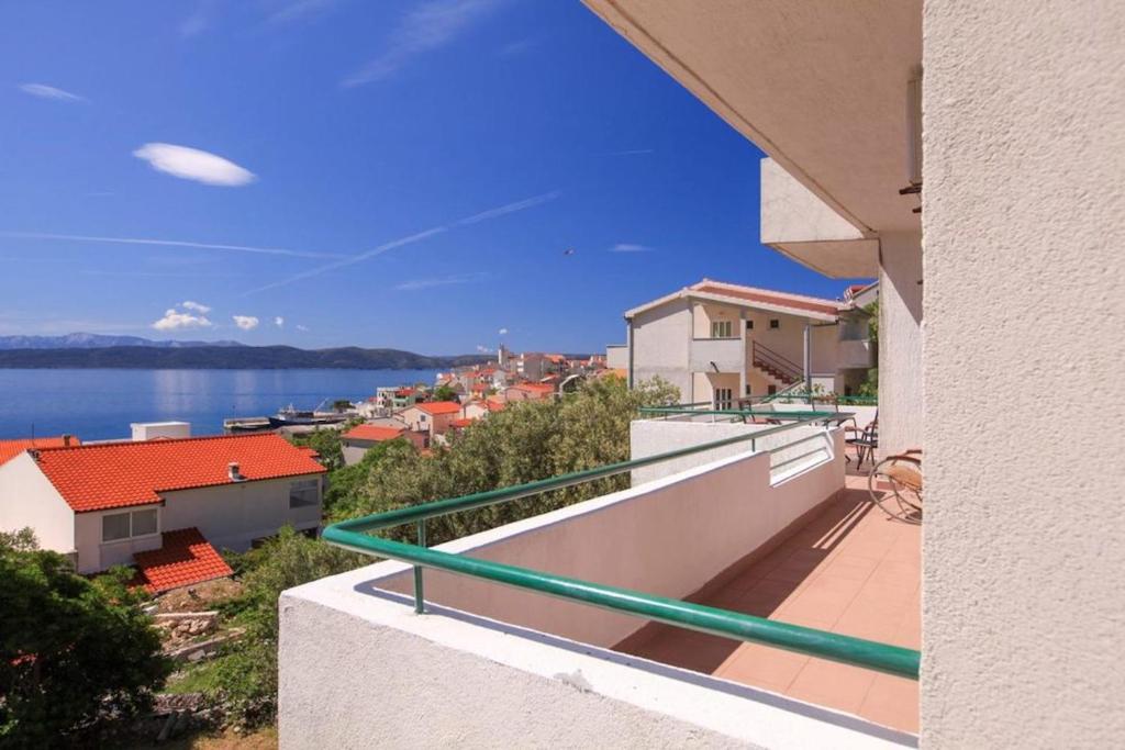a balcony of a house with a view of the water at Apartments Toni Two in Igrane