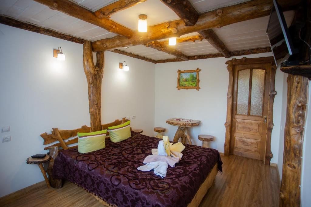 A bed or beds in a room at Сервус guest
