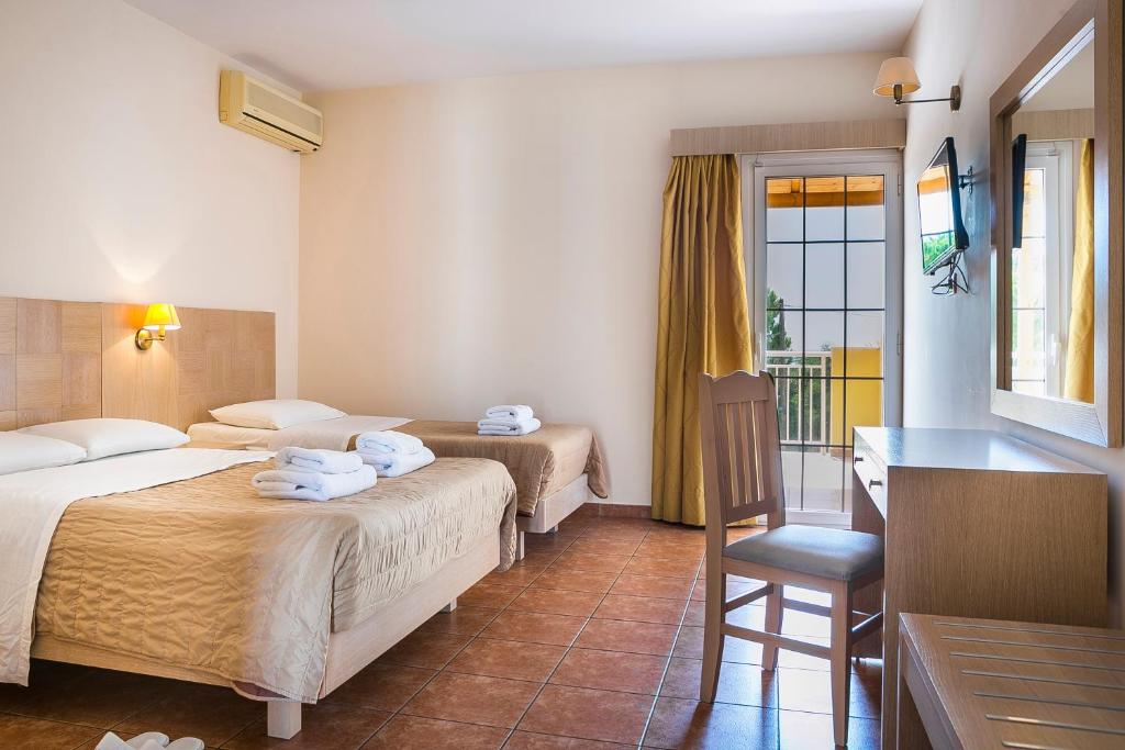 Postel nebo postele na pokoji v ubytování Lassi Hotel