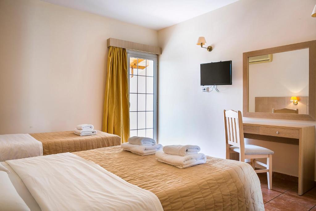 Postel nebo postele na pokoji v ubytování Lassi Hotel