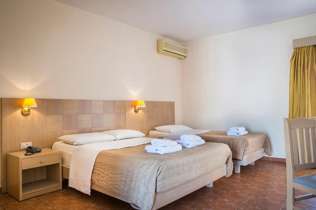 Postel nebo postele na pokoji v ubytování Lassi Hotel