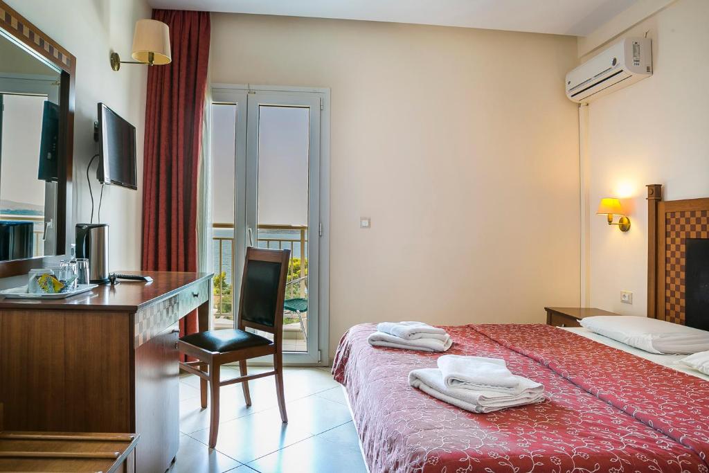 Postel nebo postele na pokoji v ubytování Lassi Hotel