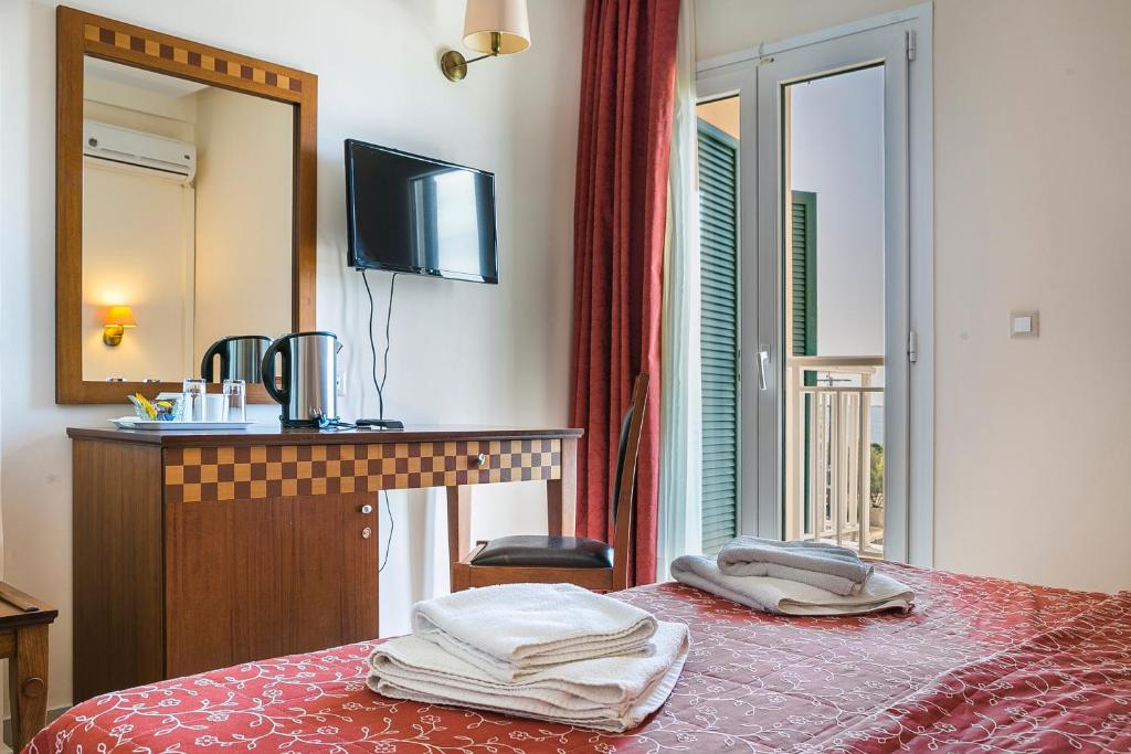 Postel nebo postele na pokoji v ubytování Lassi Hotel
