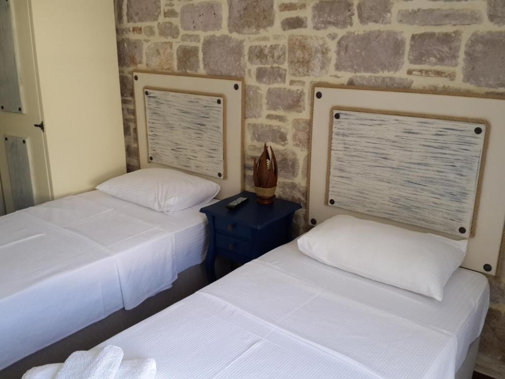 Postel nebo postele na pokoji v ubytování Gizemli Konak