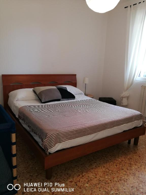 Posteľ alebo postele v izbe v ubytovaní Villa Galilei Rooms