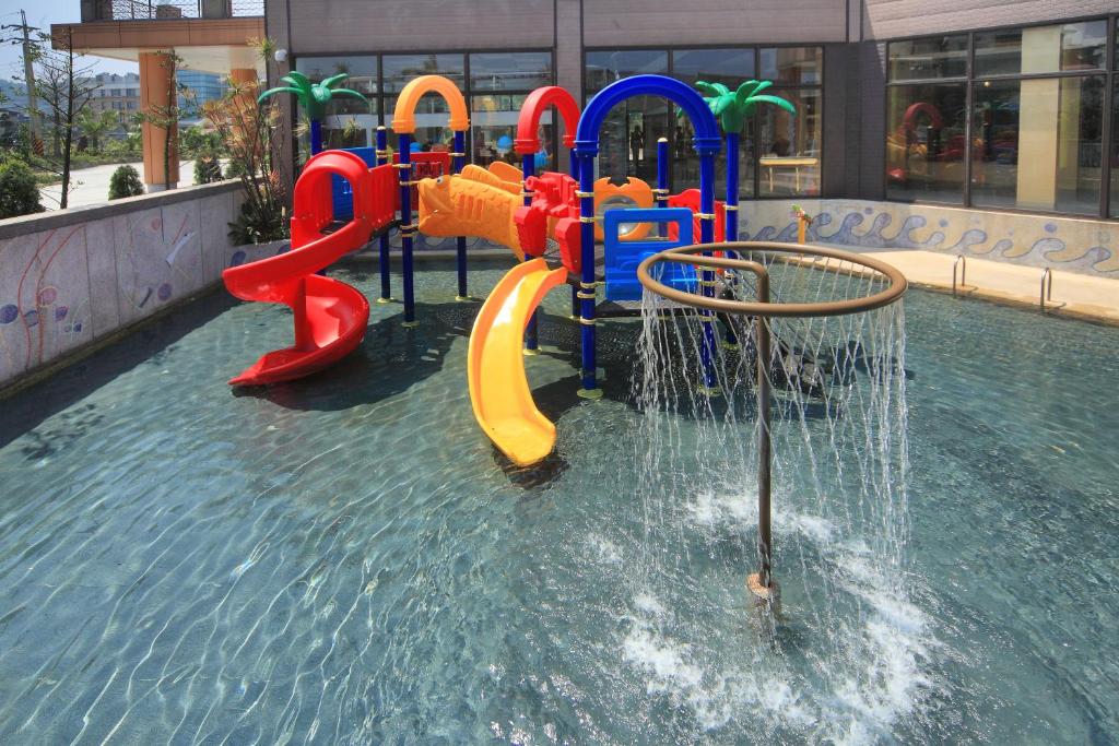 a playground in a pool of water at Jin Yong Quan Spa Hotspring Resort in Wanli District