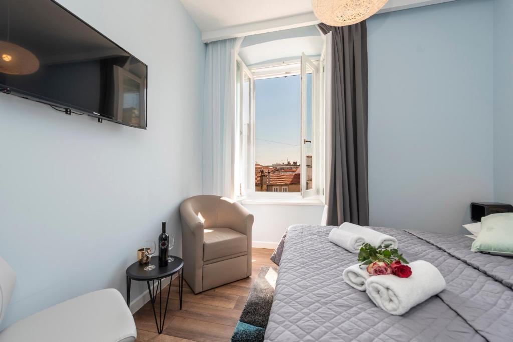 Postel nebo postele na pokoji v ubytování B&A Rooms Zadar
