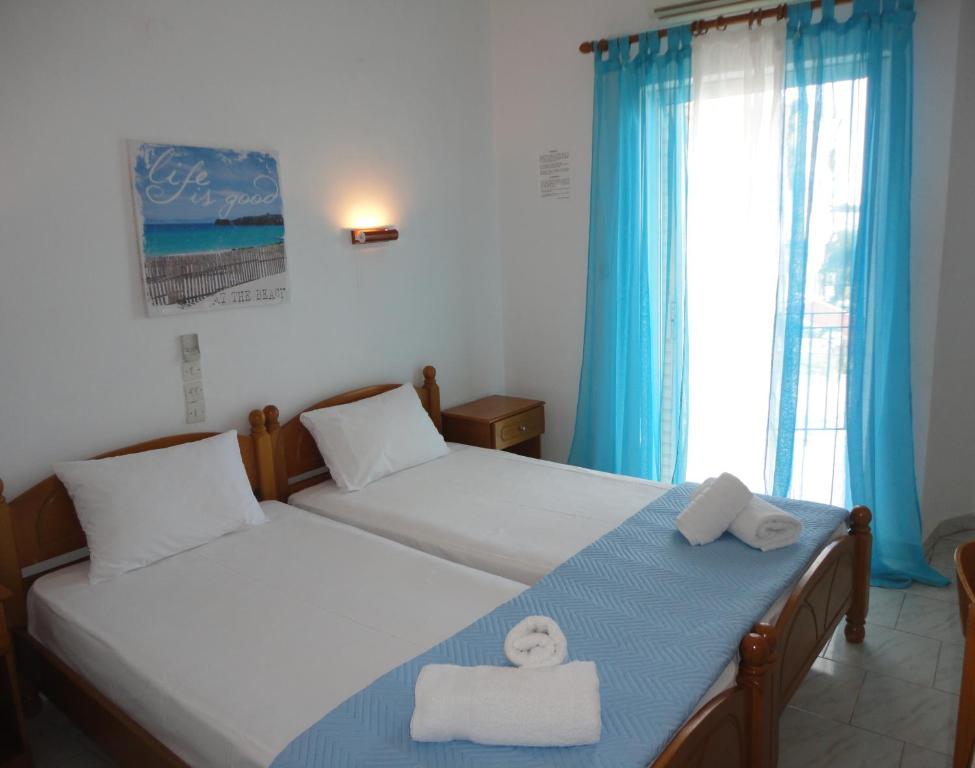 Postel nebo postele na pokoji v ubytování Mirto Beach Hotel & Restaurant