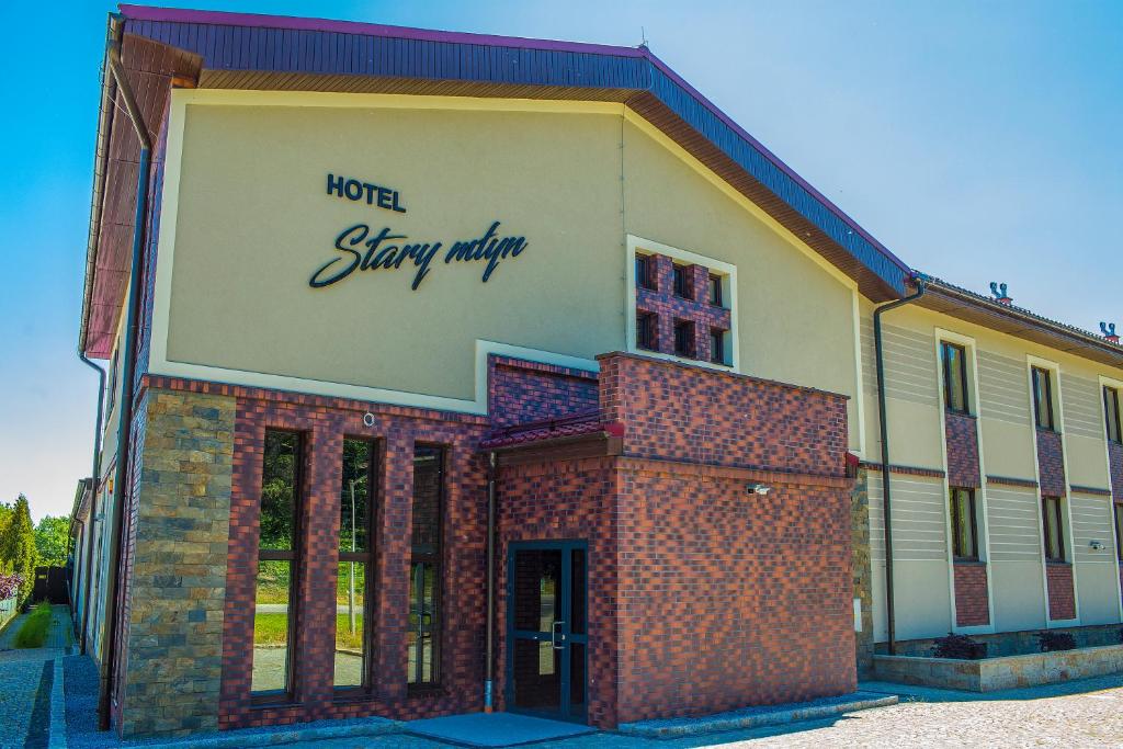 a building with a sign that reads hotel stayifty at Stary Młyn in Świdnica