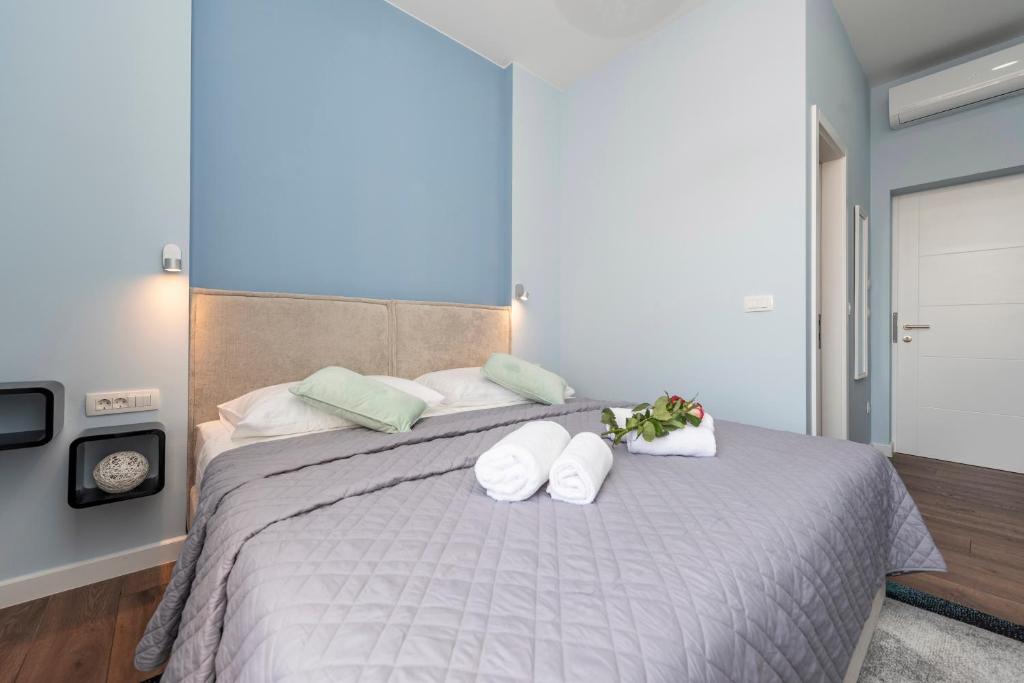 Postel nebo postele na pokoji v ubytování B&A Rooms Zadar