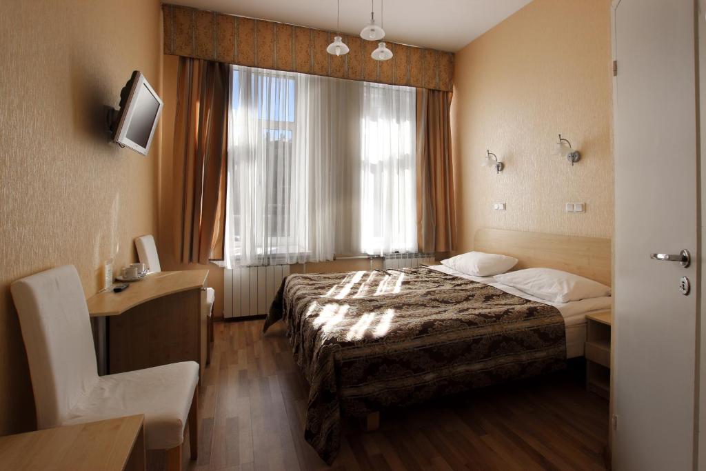 Ein Bett oder Betten in einem Zimmer der Unterkunft Bolshoy 45 Hotel