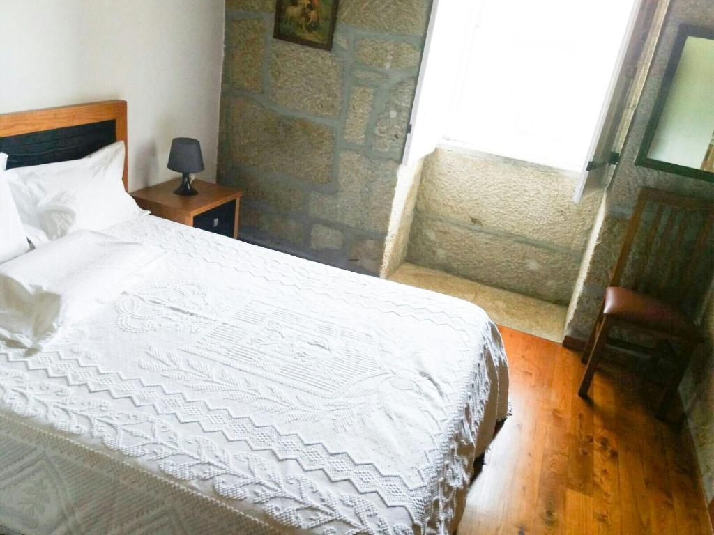 Postel nebo postele na pokoji v ubytování Casa de Campo Cabriz Casa do Brasileiro