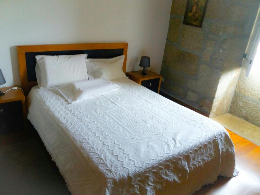 Postel nebo postele na pokoji v ubytování Casa de Campo Cabriz Casa do Brasileiro