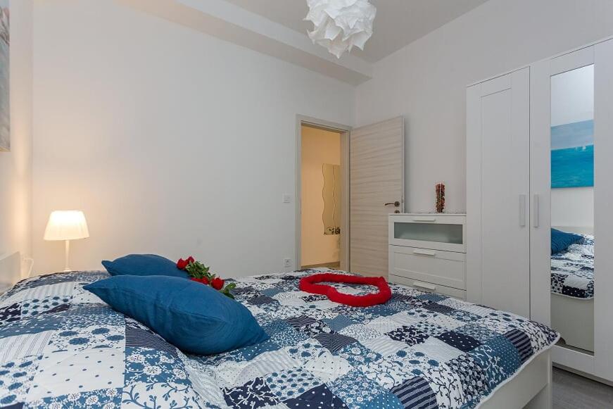 Posteľ alebo postele v izbe v ubytovaní Apartments Luksic