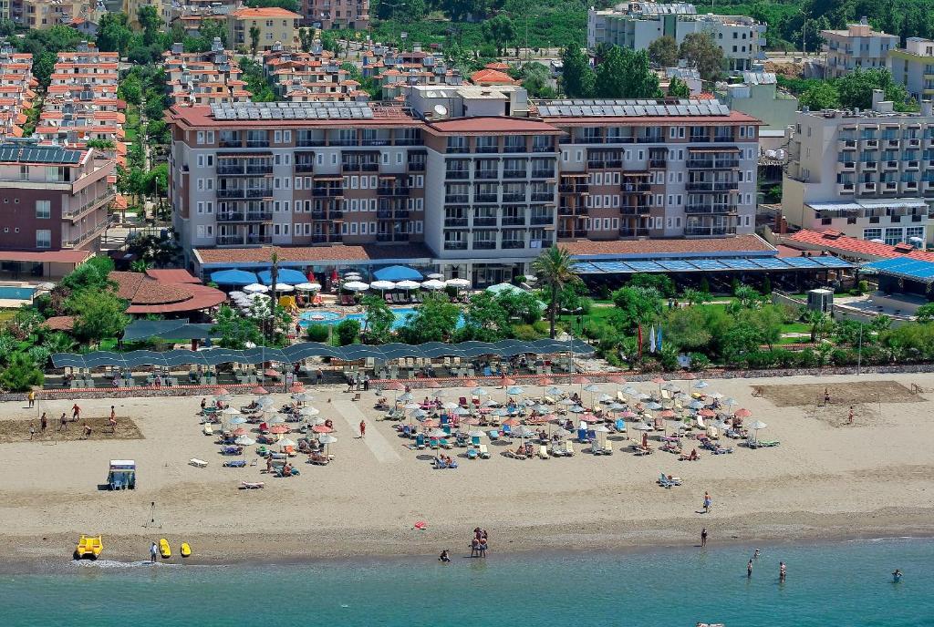 an aerial view of a beach with people on it at Club Cactus Paradise in Gumuldur