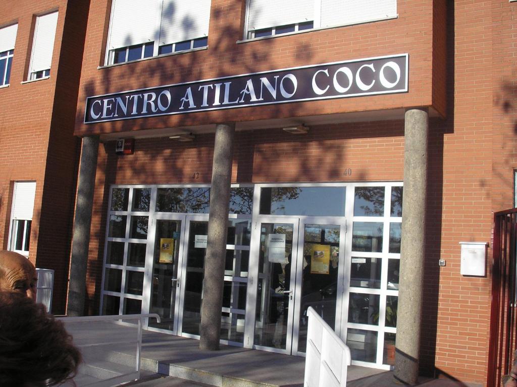 a building with a sign that reads caffe atlanticoco at Residencia Universitaria Atilano Coco in Salamanca