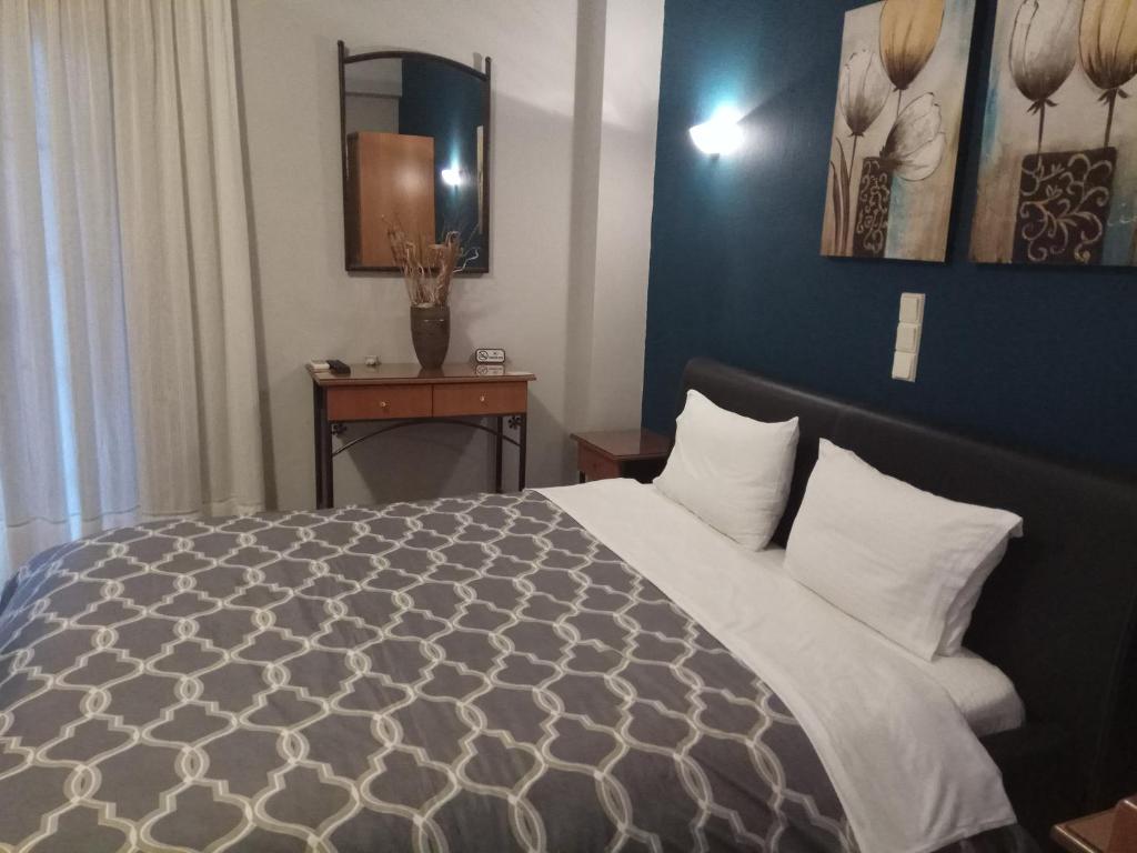 Posteľ alebo postele v izbe v ubytovaní Zisis Garden Studios