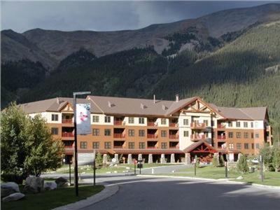 a large apartment building with a mountain in the background at Copper Springs 215 in Copper Mountain