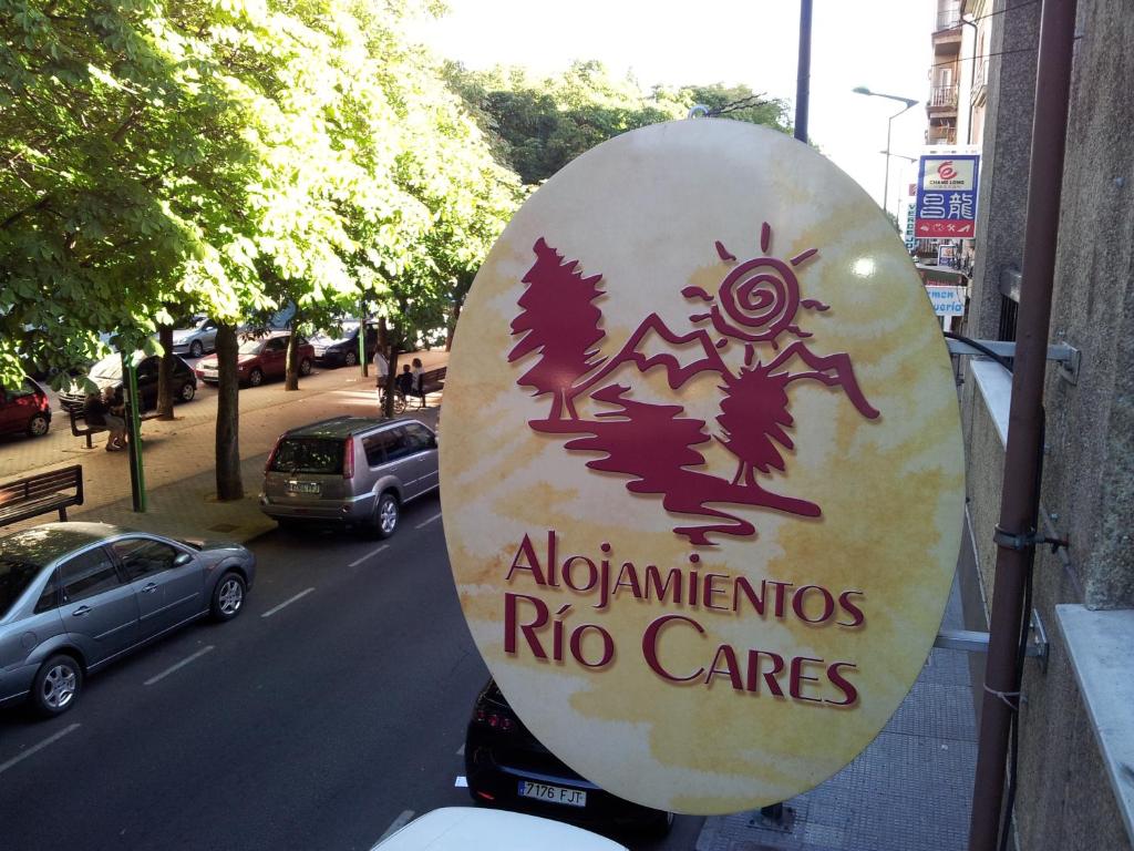 a sign on the back of a motorcycle parked on a street at Alojamientos Río Cares in León