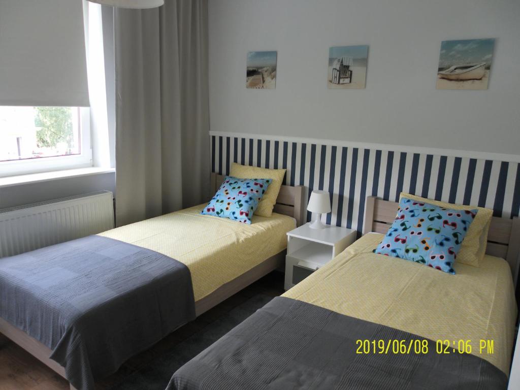 Posteľ alebo postele v izbe v ubytovaní Apartamenty Premium 200m. do plaży