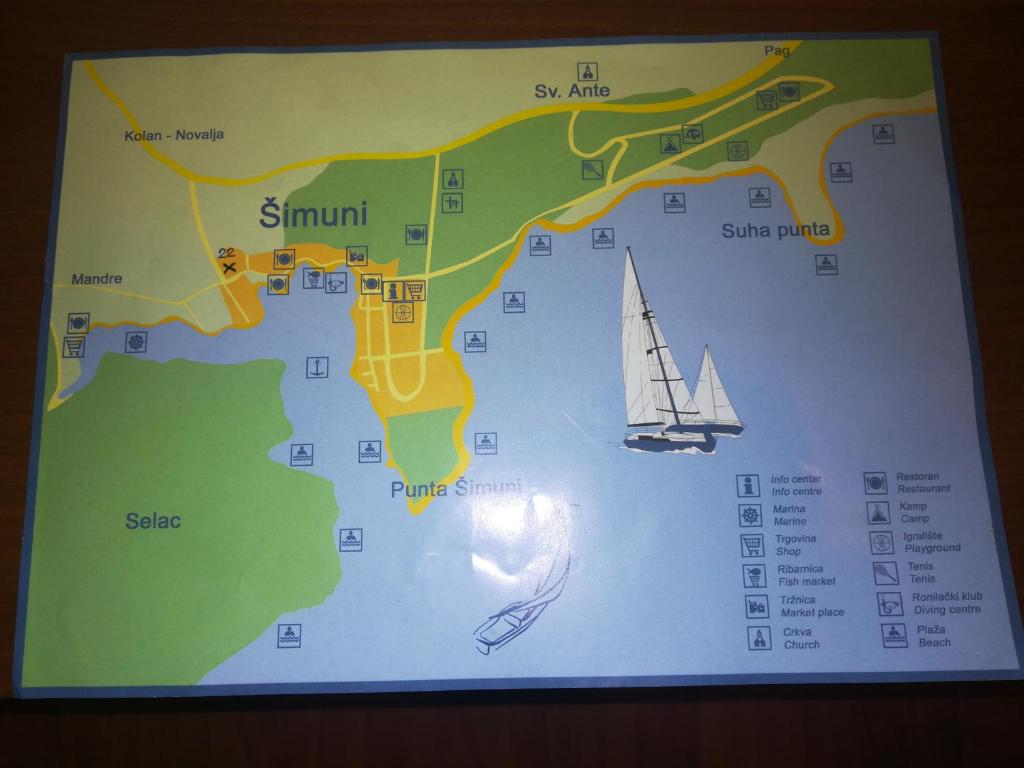 a map with a sail boat on it at Apartments Antica in Šimuni