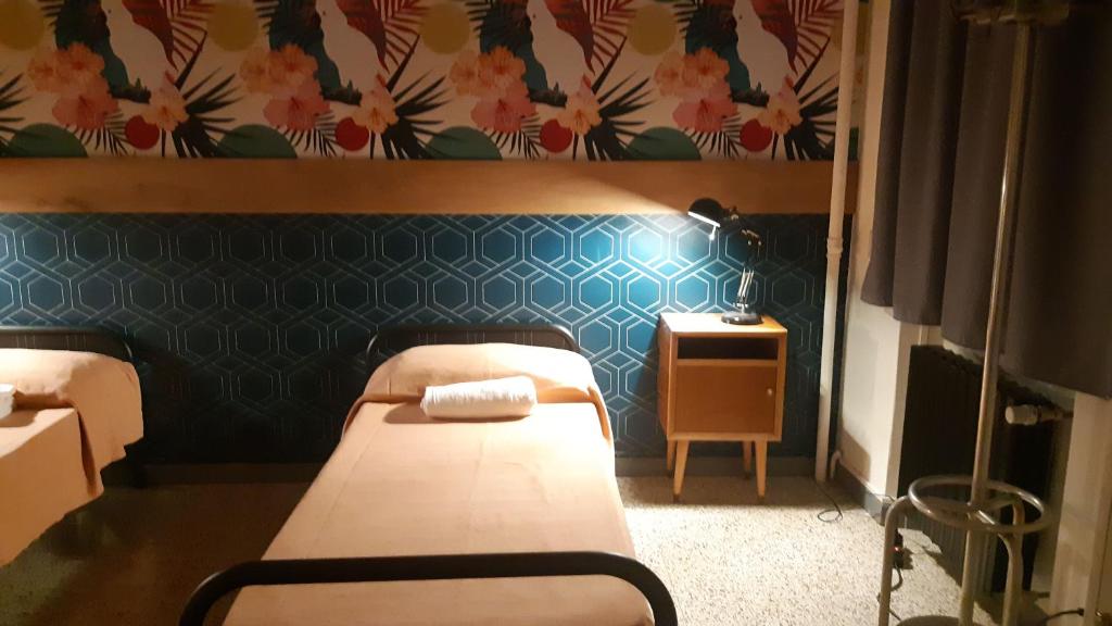 Postel nebo postele na pokoji v ubytování Ostello Tasso