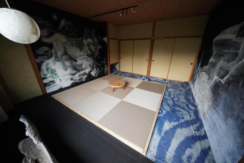 Postel nebo postele na pokoji v ubytování ARtINn 極寒藝術伝染装置