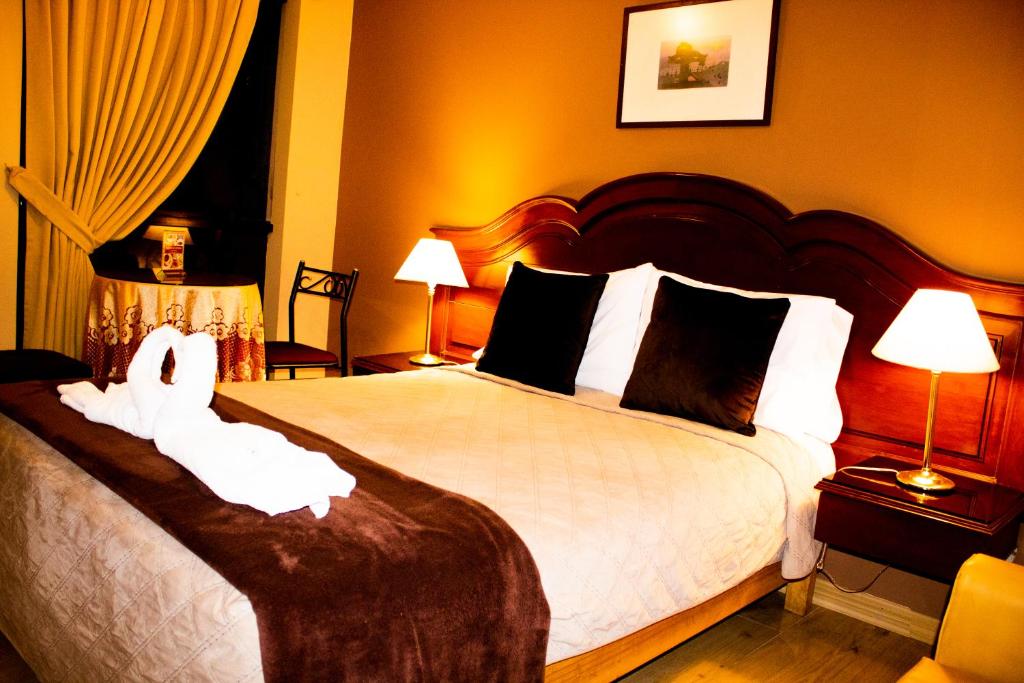 Postel nebo postele na pokoji v ubytování Solis Dies Hotel