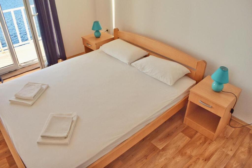 Un ou plusieurs lits dans un hébergement de l'établissement Mljet Sunset Apartments