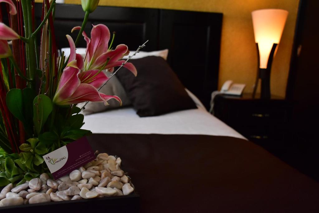 Postel nebo postele na pokoji v ubytování Hotel Suite Azomali