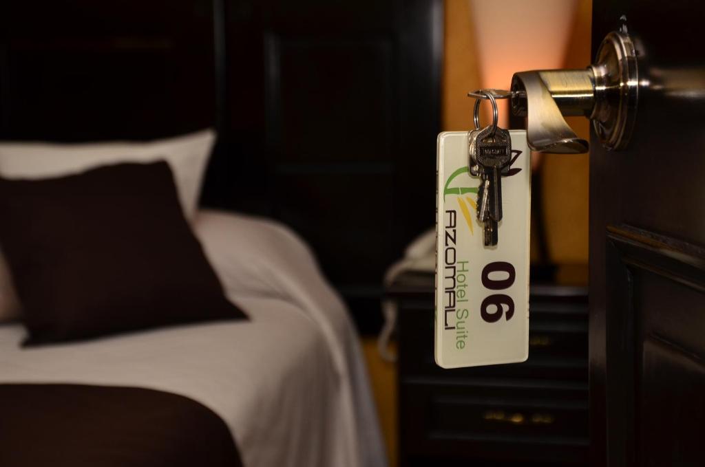 Postel nebo postele na pokoji v ubytování Hotel Suite Azomali
