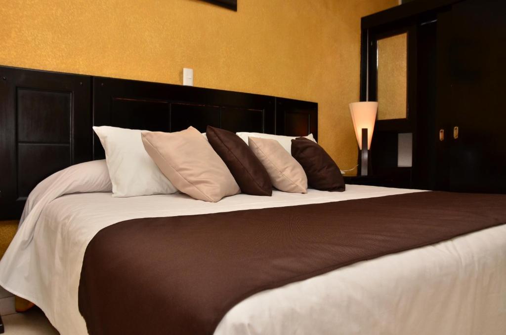 Postel nebo postele na pokoji v ubytování Hotel Suite Azomali