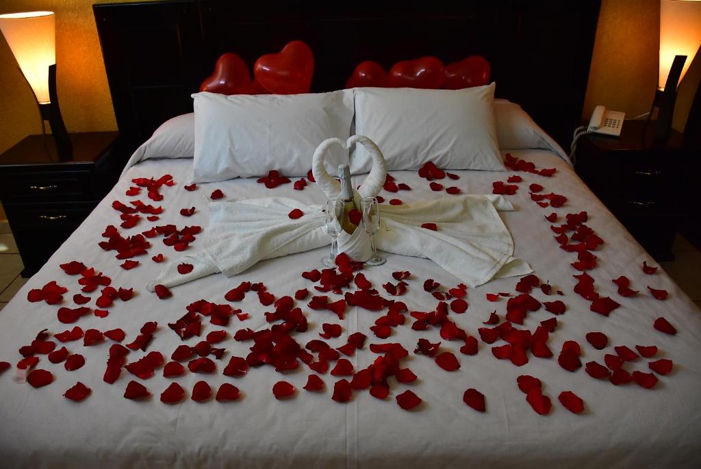 Postel nebo postele na pokoji v ubytování Hotel Suite Azomali
